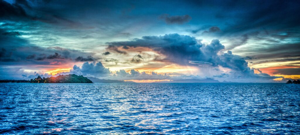 Image of a blue ocean. In business strategy, a "red ocean" refers to an existing market with intense competition where companies fight for a share of existing demand, often leading to price wars and low profit margins, while a "blue ocean" represents a new, untapped market space with little competition, where companies can create new demand by introducing innovative products or services that differentiate them from existing players;