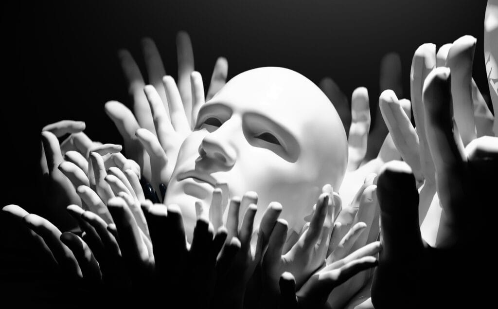 A picture of one head and many hands